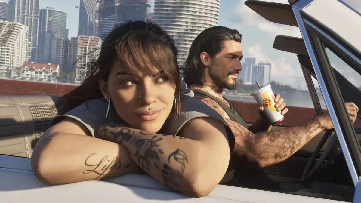 Lucia and Jason in a convertible with Vice City skyscrapers behind them